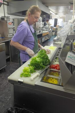 Terry prepares a sandwich